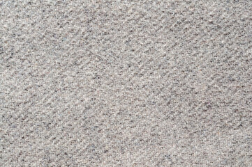 Close-up of a textured gray fabric with a subtle woven pattern