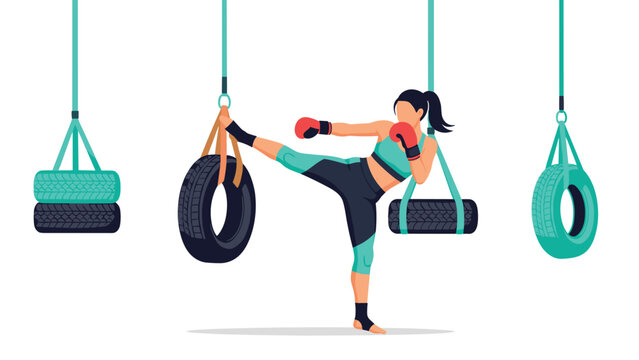 Woman practicing kickboxing with hanging tires in gym for fitness training and muscle strength