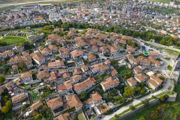 Aerial view of Berat Castle&rsquo;s traditional hilltop homes, stone streets and cityscape unfolding across the Osum River valley.