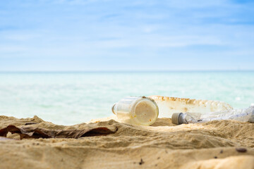 Plastic waste, plastic cups at the beach. Concept of environmental problems and saving the plane	