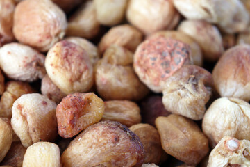 Natural dried apricots background top view macro