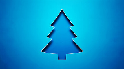 A christmas tree cutout in a blue paper with a slightly darker shade inside the tree shape design