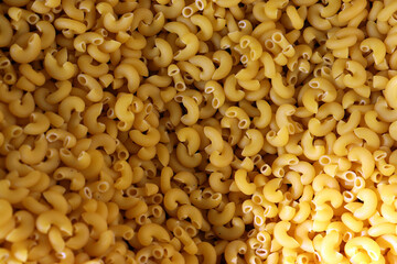 Elbow macaroni pasta close up dry pasta texture