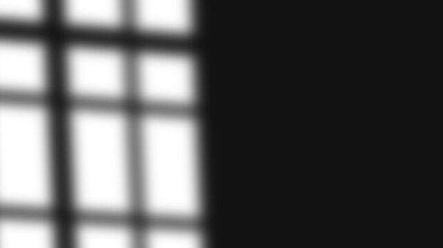 Soft window shadow overlay with blurred edges on black background, aesthetic natural sunlight reflection effect for product display, mockup, or wallpaper design