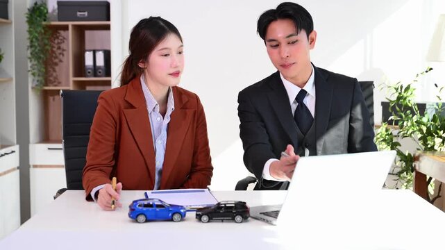 Lawyer and client discussing car insurance claims using vehicle accident models in a modern office.insurance, legal advice, accident claim, and vehicle consultation.
