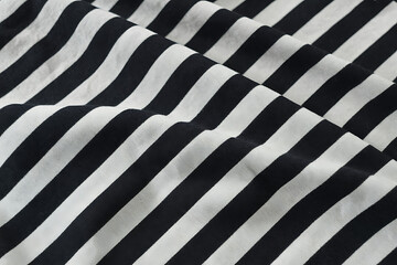 Closeup of black and white striped fabric with soft folds