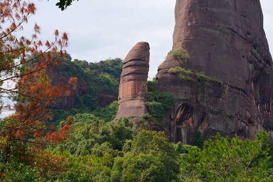 Rock formations in Danxia Mountains (Danxiashan) in Renhua County in Shaoguan (Guangdong Province) in China. Yang Yuan Stone (Yangyuan) also known as Male Stone, known for its phallic shape.