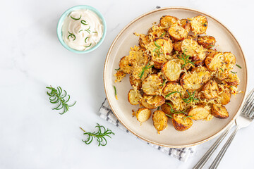 Crunchy Oven-Baked Potato Wedges With Condiment Garnished With Fresh Rosemary