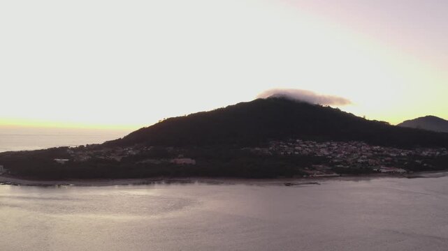 sunrise light over monte santa tecla and the calm waters of moledo do minho