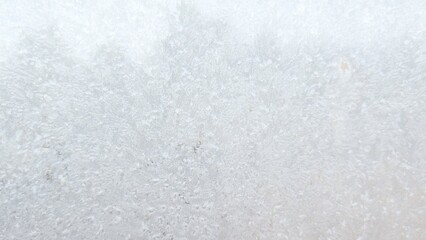 white frost pattern on frozen window seamless freezing icy glass texture abstract bright christmas winter background