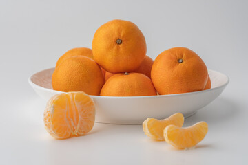 tangerines in a white plate