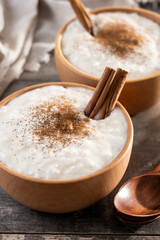 Creamy homemade Spanish custard served in a bowl on wooden table