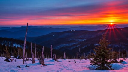 Majestic mountain landscape basking in the ethereal glow of dawn with stunning winter colors