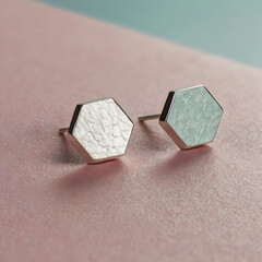 Elegant hexagon-shaped earrings showcasing minimalist design and modern jewelry style. The unique surface textures and meticulous craftsmanship add to their beauty.