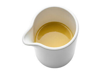 Isolated gravy boat filled with flavorful broth of clear consomm&eacute; close up view, food photography