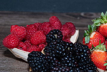 Fresh fruit   raspberries blackberries  close up   rustic