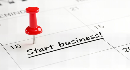 Calendar with start business marked by a red thumbtack, symbolizing new ventures, isolated
