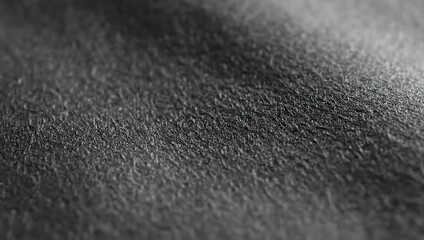 Close Up Of Finger Touching Textured Black Fabric With A Shiny Line Detail - Powered by Adobe