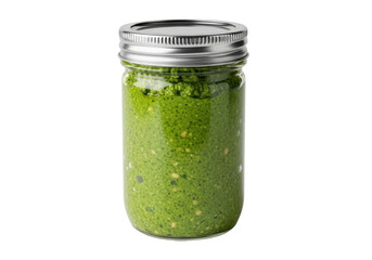 Isolated mason jar of fresh vibrant homemade pesto sitting upright and unadorned, kitchen food