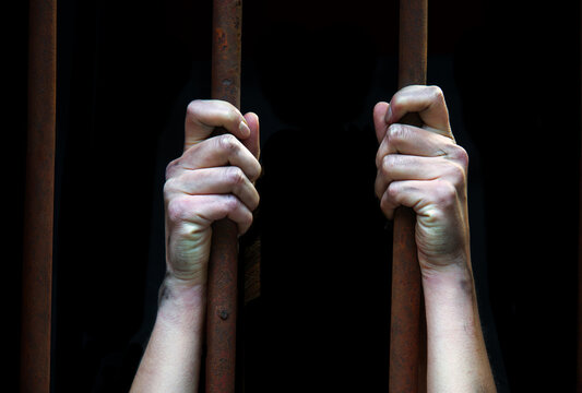 Sad young girl in prison