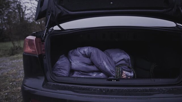 4k Crime Shot of Victim Hidden in the Car Boot