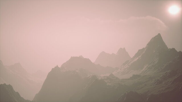 In this serene setting, majestic mountains emerge from a gentle mist, bathed in soft sunlight. The atmosphere feels peaceful, evoking a sense of tranquility in natures embrace.