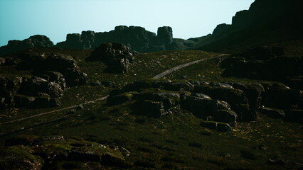 A vast, rocky terrain stretches across the landscape, with towering formations casting shadows under a calm sky. The tranquility of nature envelops the scene, inviting exploration.