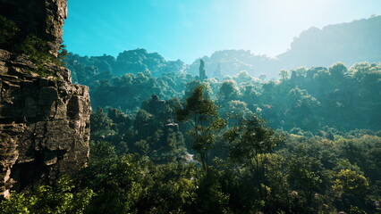 A peaceful landscape showcases towering mountains and vibrant trees under a clear blue sky. Soft sunlight bathes the entire scene, highlighting nature&rsquo;s beauty in vivid colors.