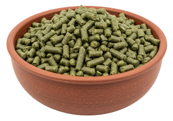 Isolated terracotta bowl filled with nutritious green rabbit food pellets, ready to eat