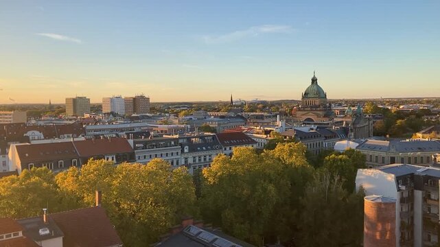 Panorama motion view over Leipzig city center with warm sun light in afternoon