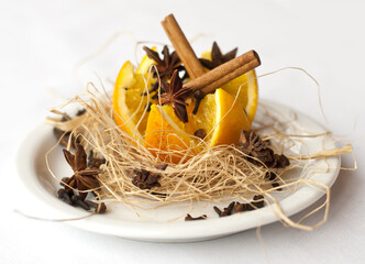 christmas decoration with orange, cinnamon and nuts

