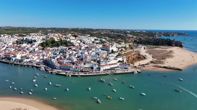 Aerial video from the little touristic historical town Ferragudo in the Algarve Portugal