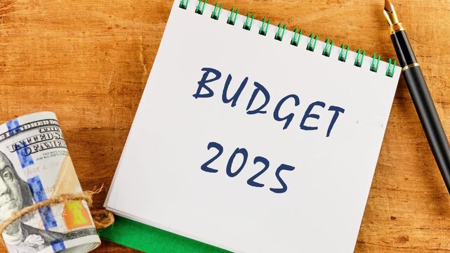 Conceptual tax 2025 symbol. Business concept. Animation, the appearance of a phrase, text BUDGET 2025 in a notebook on a blank sheet