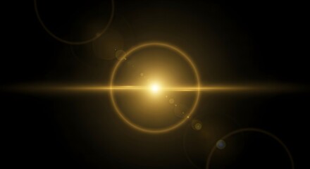 Obraz premium Bright golden lens flare effect on a dark background