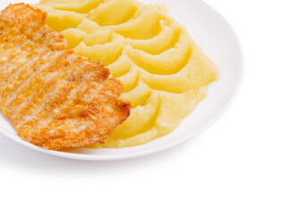 Crispy fish or chicken fillet served with creamy mashed potatoes dinner plate