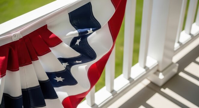 American flag bunting draped over railing on sunny day for Independence Day  