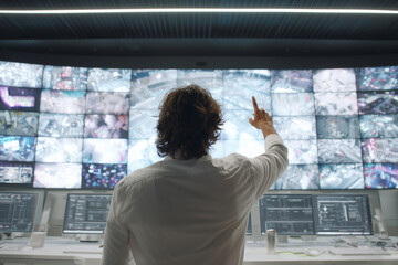 Young people watching digital television and businesswoman looking at a virtual screen map concept