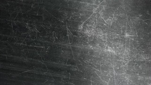 A textured surface with scratches and marks, resembling a worn metal or stone background.