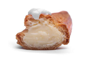 A cream puff, or eclair, cut in half to show the rich custard filling and topped with white glaze against a clean white background.