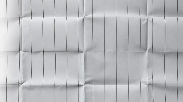 Wrinkled white paper with vertical lines creating a textured background.