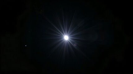 A bright star shining brilliantly in the night sky, with a hint of another celestial object. A celestial spectacle