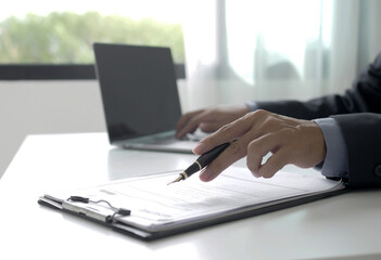 Businessman employer looking for resume to hire candidate, holding resume to hire candidate, analyzing data before job interview, recruiting concept