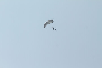 paraglider in the blue sky