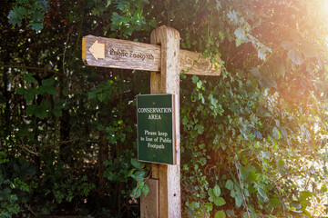 wooden footpath sign in a conservation area
