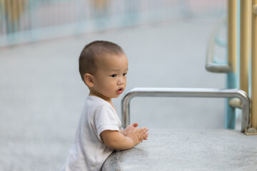 Little baby enjoy play time at park