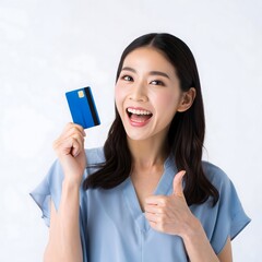 Excited Woman Holding Credit Card and Giving Thumbs Up