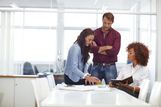 Business, people and talk in office with diary for schedule review, daily goals and collaboration. Team, discussion and meeting with planner for calendar management, task priority and administration.