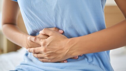 Woman Holding Her Stomach in Pain - Healthcare Concept