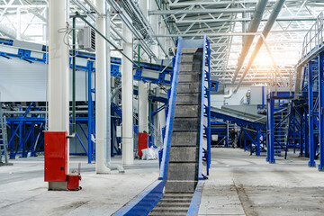 Plastic waste is moving on Recycling facility with conveyor belt sorting in industrial setting