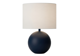 Isolated table lamp with a round, dark blue base and a cream-colored drum shade near a wall